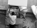 Searching for clothes in a dumpster of old clothes, Bari, 2008