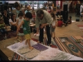 "Mille passi", percorso a piedi scalzi su materiale di scarto, durante il Suq Festival nel porto antico, Genova, 23 giugno 2014